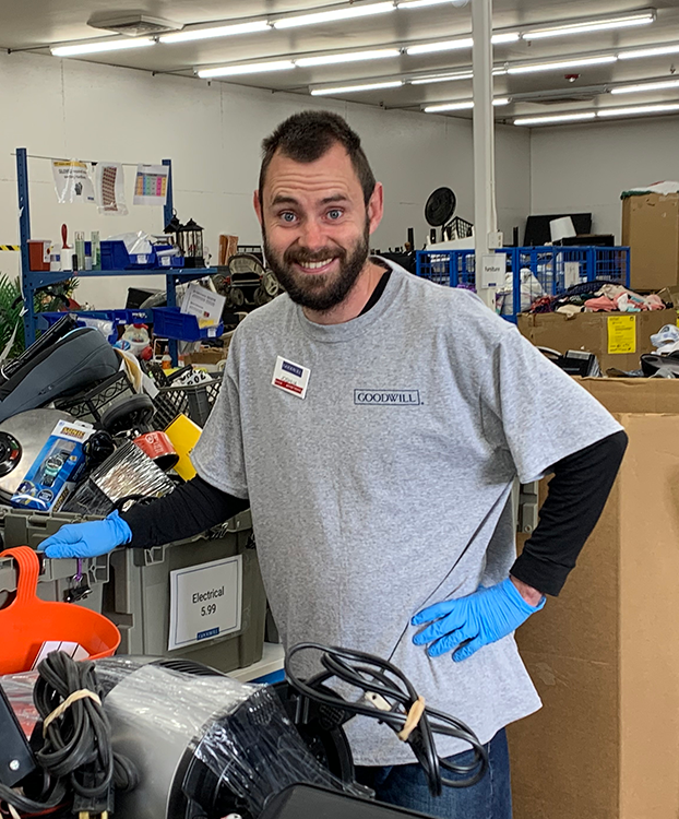 Male Goodwill employee in the Goodwill production area.